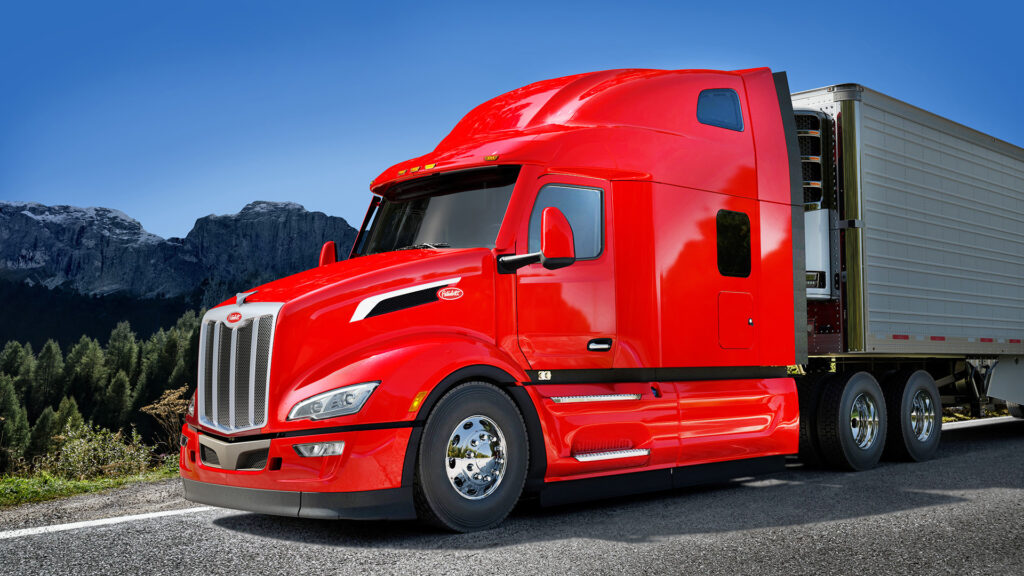 Peterbilt 579 UltraLoft rouge avec remorque frigorifique.