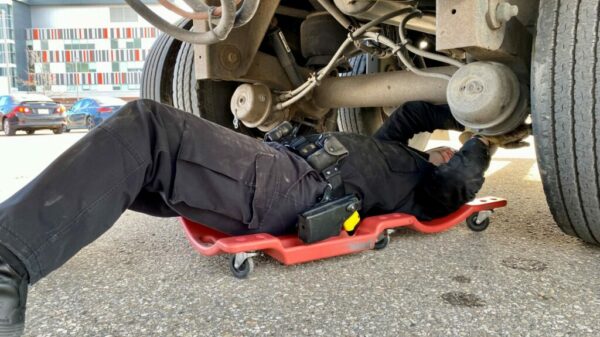 Truck-inspection-Halton-officer-under-truck-1024×768-credit-Leo-Barros alternate text for this image