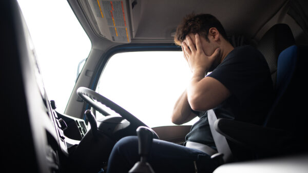 Male truck driver is crying alternate text for this image