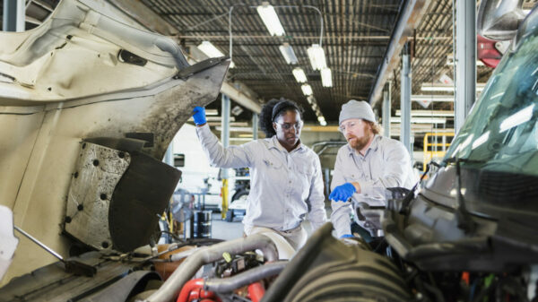Team of mechanics repairing semi-truck alternate text for this image