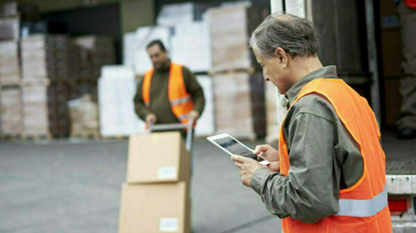 Senior Male Transportation Foreman Using Digital Tablet alternate text for this image