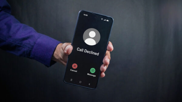 Man holding a smartphone with Call Declined screen. Rejected phone call concept. alternate text for this image