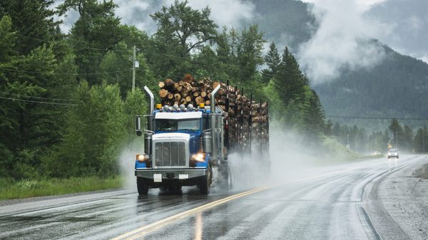 Semi-Truck on a Highway in the Canadian Rocky Mountains of British Columbia, Canada alternate text for this image